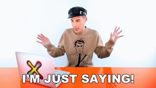 A Man Sitting In Front Of A Laptop With The Words I 'M Just Saying Written Below Him GIF