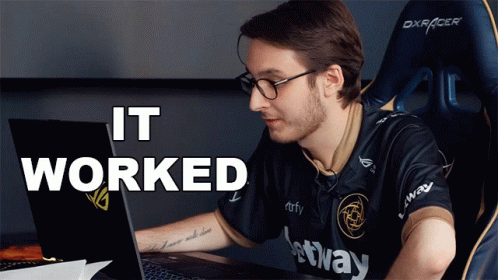 A Man Sitting In Front Of A Laptop With The Words " It Worked " Behind Him GIF