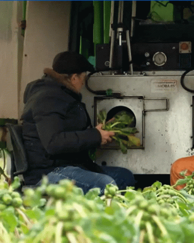 A Man Sitting In Front Of A Machine That Says Moba Ev On It GIF