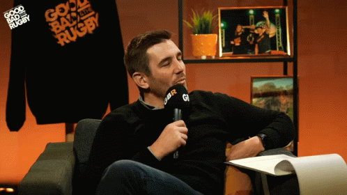 A Man Sitting In Front Of A Microphone That Says Gbr On It GIF