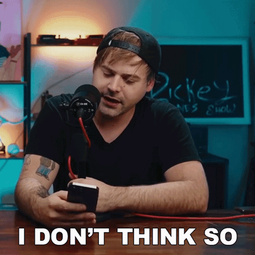 A Man Sitting In Front Of A Microphone With The Words " I Don 'T Think So " Written On The Bottom GIF
