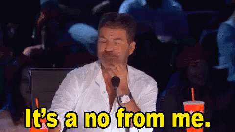 A Man Sitting In Front Of A Microphone With The Words It 'S A No From Me . GIF