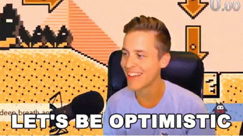A Man Sitting In Front Of A Microphone With The Words Let 'S Be Optimistic GIF
