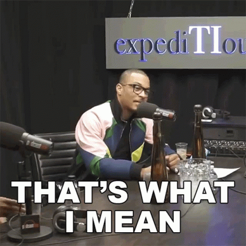 A Man Sitting In Front Of A Microphone With The Words That 'S What I Mean GIF