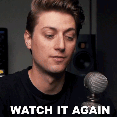 A Man Sitting In Front Of A Microphone With The Words Watch It Again On The Bottom GIF
