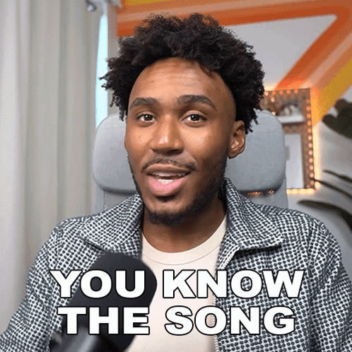 A Man Sitting In Front Of A Microphone With The Words " You Know The Song " On His Face GIF