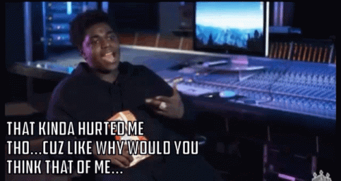 A Man Sitting In Front Of A Mixer With The Words That Kinda Hurted Me GIF