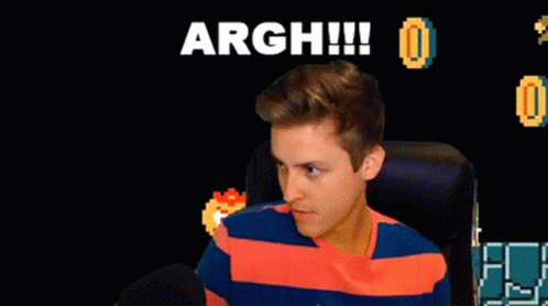 A Man Sitting In Front Of A Screen That Says Argh GIF