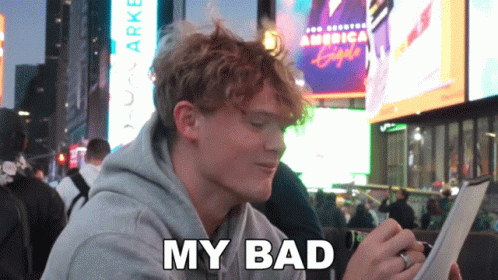 A Man Sitting In Front Of A Sign That Says America Eagle GIF