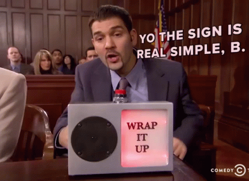 A Man Sitting In Front Of A Sign That Says " Wrap It Up " GIF