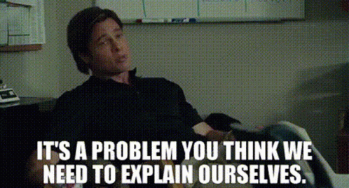 A Man Sitting In Front Of A White Board With The Words It 'S A Problem You Think We Need To Explain Ourselves GIF