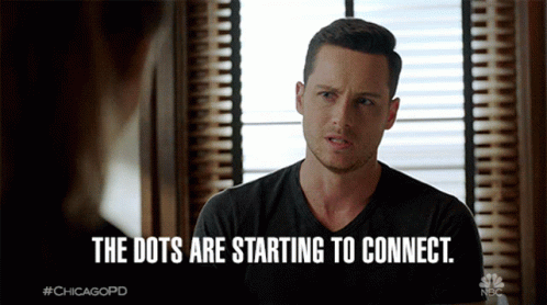 A Man Sitting In Front Of A Window With The Words " The Dots Are Starting To Connect " GIF