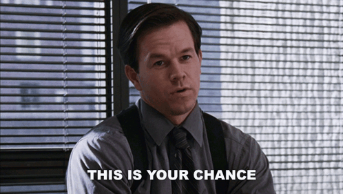 A Man Sitting In Front Of A Window With The Words This Is Your Chance Above Him GIF