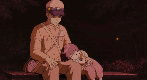 A Man Sitting On A Bench Holding A Little Girl Who Is Sleeping On His Lap GIF