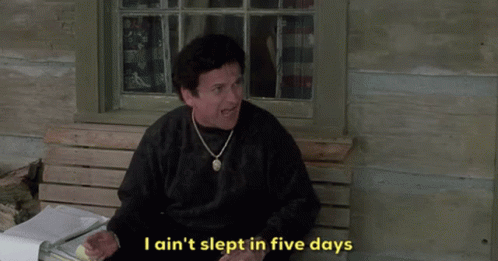 A Man Sitting On A Bench With The Words I Ain T Slept In Five Days Below Him GIF