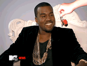 A Man Sitting On A Chair With A Mtv News Advertisement GIF