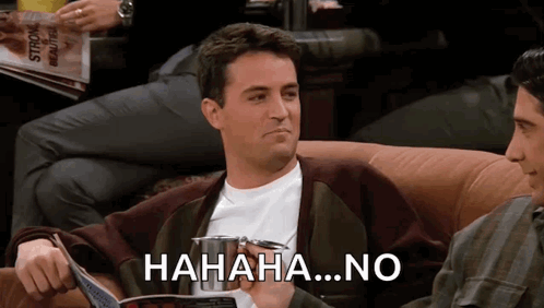 A Man Sitting On A Couch Laughing With The Words " Hahaha No " Written On The Bottom GIF