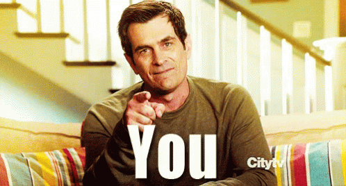 A Man Sitting On A Couch Wearing A Shirt That Says " You " GIF