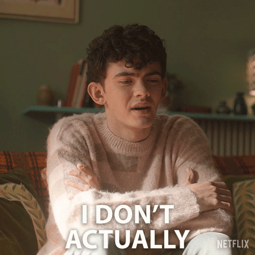A Man Sitting On A Couch With His Arms Crossed And The Words I Do N't Actually Written Below Him GIF