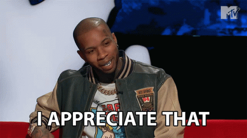 A Man Sitting On A Couch With The Words I Appreciate That Above Him GIF