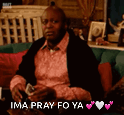 A Man Sitting On A Couch With The Words Ima Pray Fo Ya Written On The Bottom GIF