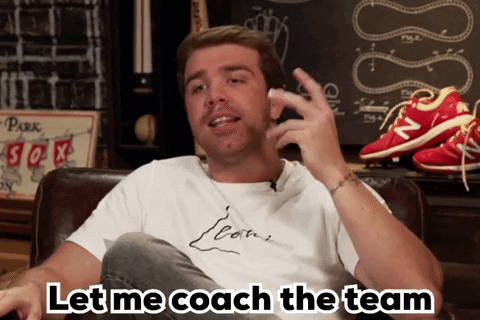 A Man Sitting On A Couch With The Words Let Me Coach The Team Written Below Him GIF