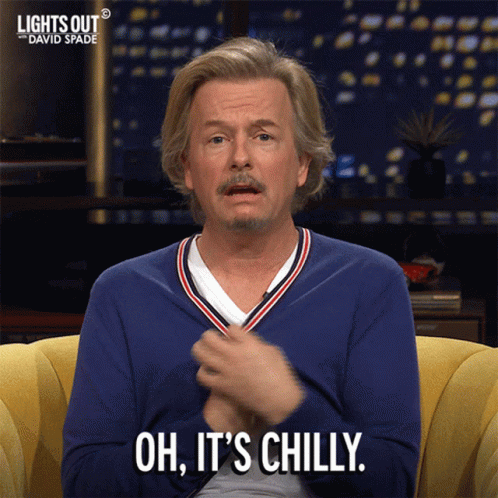 A Man Sitting On A Couch With The Words Oh It 'S Chilly On His Face GIF