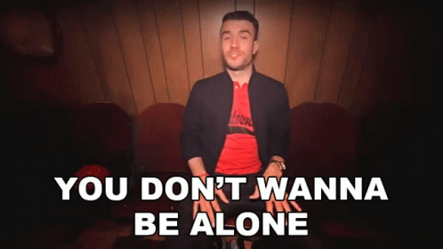 A Man Sitting On A Couch With The Words " You Don T Wanna Be Alone " GIF