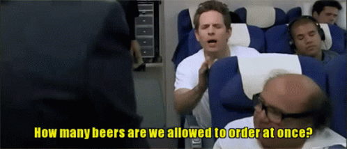 A Man Sitting On A Plane Asking How Many Beers Are We Allowed To Order At Once GIF