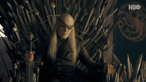 A Man Sitting On A Throne With A Sword And A Hbo Logo In The Background GIF