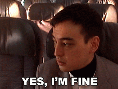 A Man Sitting On An Airplane With The Words Yes I 'M Fine Above Him GIF