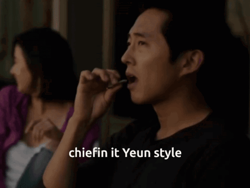 A Man Smoking A Cigarette With The Words " Chiefin It Yeun Style " Written Below Him GIF