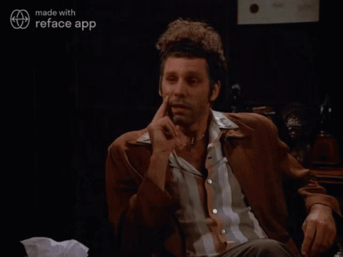 A Man Smoking A Cigarette With The Words That 'S True Behind Him GIF