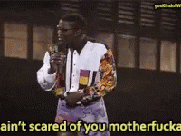 A Man Speaking Into A Microphone With The Words Ain T Scared Of You Motherfucker GIF
