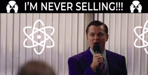 A Man Speaking Into A Microphone With The Words I 'M Never Selling Behind Him GIF