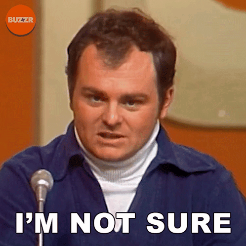 A Man Speaking Into A Microphone With The Words I 'M Not Sure Below Him GIF
