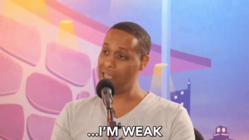 A Man Speaking Into A Microphone With The Words I 'M Weak Below Him GIF