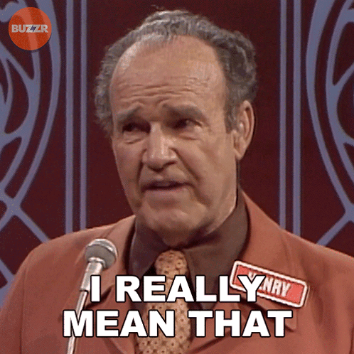 A Man Speaking Into A Microphone With The Words " I Really Mean That " Above Him GIF