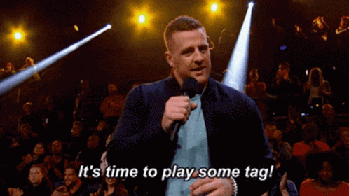 A Man Speaking Into A Microphone With The Words It 'S Time To Play Some Tag GIF
