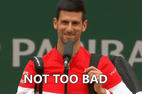 A Man Speaking Into A Microphone With The Words " Not Too Bad " Written Below Him GIF
