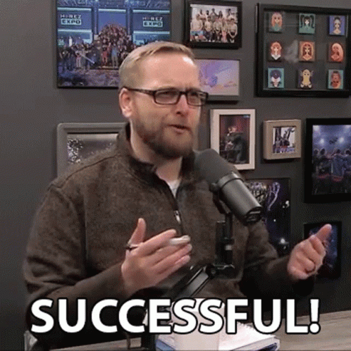 A Man Speaking Into A Microphone With The Words Successful Written On The Bottom GIF