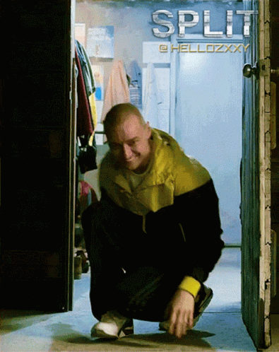 a man squatting in front of a sign that says split on it