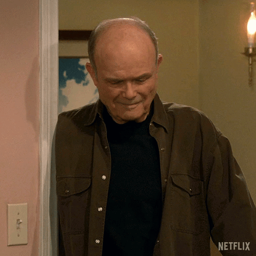 A Man Standing In A Doorway With A Netflix Logo On The Bottom GIF