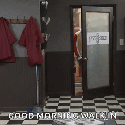 A Man Standing In A Doorway With The Words " Good Morning Walk In " On The Bottom GIF