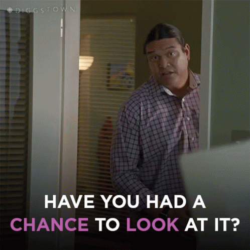A Man Standing In A Doorway With The Words Have You Had A Chance To Look At It Below Him GIF