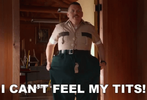 A Man Standing In A Doorway With The Words I Can 'T Feel My Tits Below Him GIF