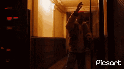 A Man Standing In A Hallway With The Words Blockchain Welcome In Written On The Bottom GIF