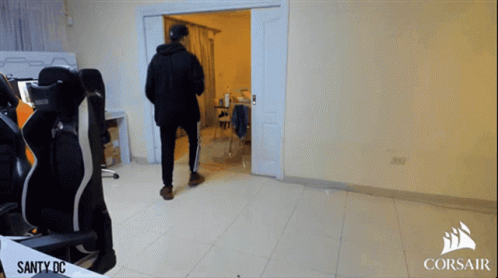 a man standing in a room with corsair written on the bottom