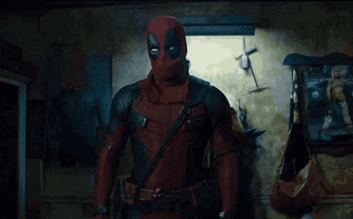 A Man Standing In A Room With Smoke Coming Out Of His Chest GIF