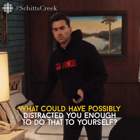A Man Standing In Front Of A Bed With The Words What Could Have Possibly Distracted GIF